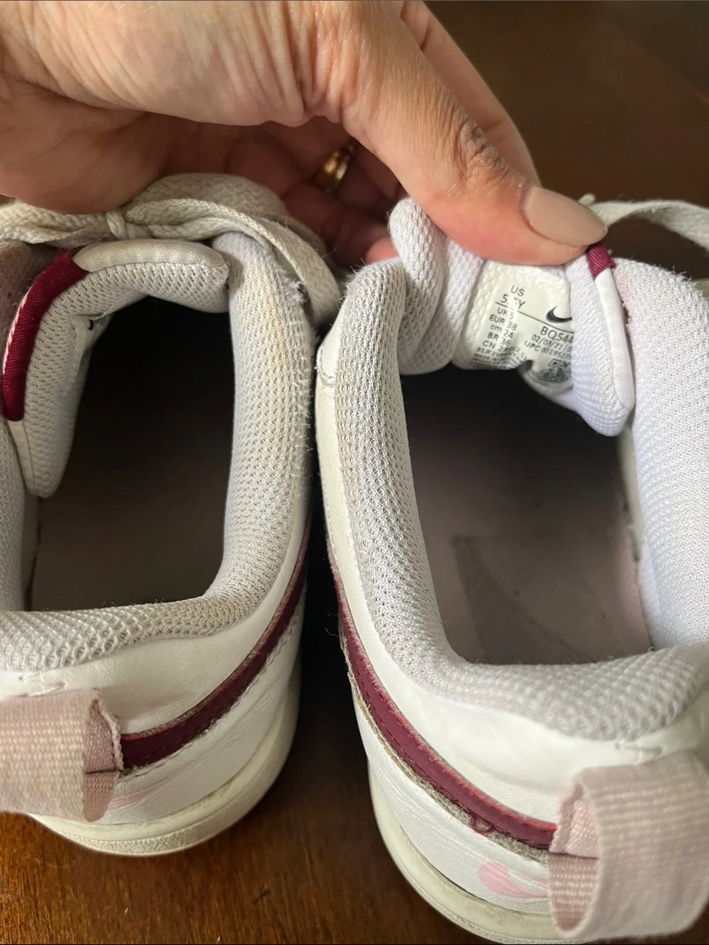 Nike Kids White Sneakers with Maroon Swoosh and Light Pink Details